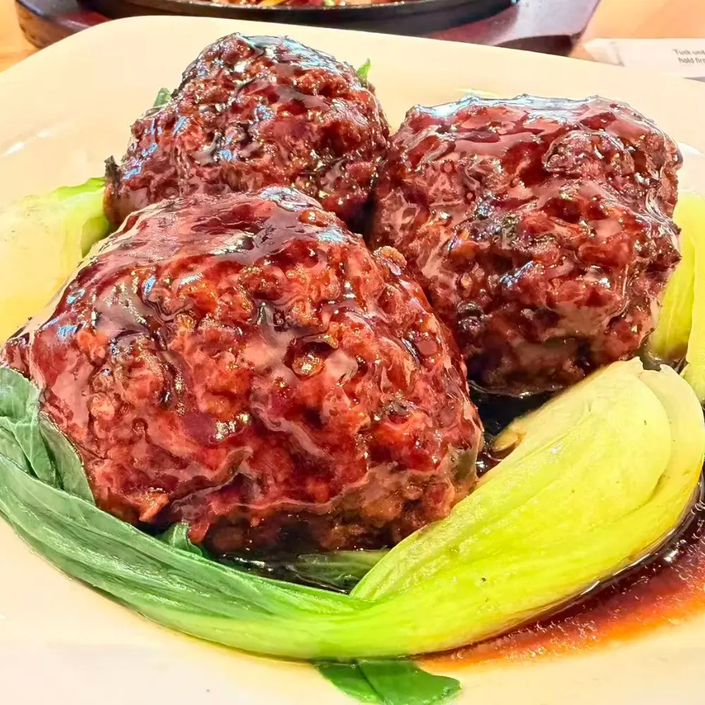 Braised lion's head meatballs in sauce at Dallas Spicy Chinese Cuisine, a Chinese Restaurant in Plano.